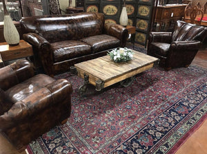 Brown leather sofa and chairs for the living room. 
