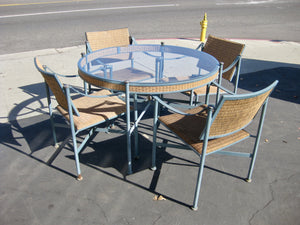 Outdoor round glass patio table with 4 chairs. 